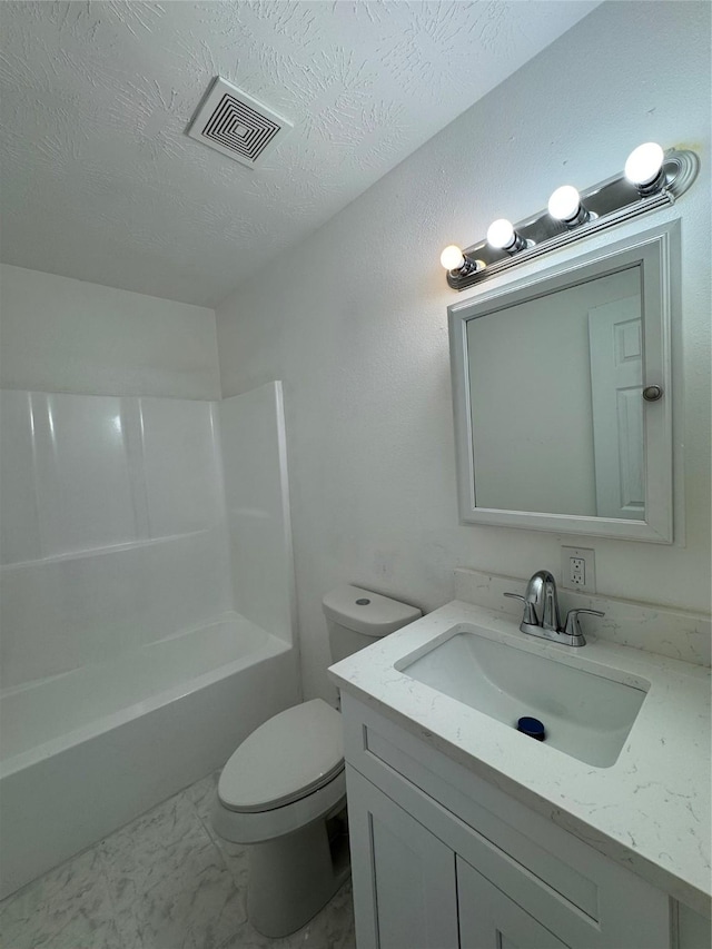 full bathroom featuring vanity, toilet, shower / bath combination, and a textured ceiling