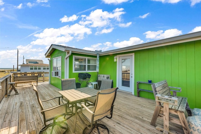 wooden terrace featuring cooling unit