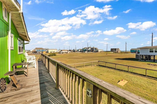 wooden terrace with a yard