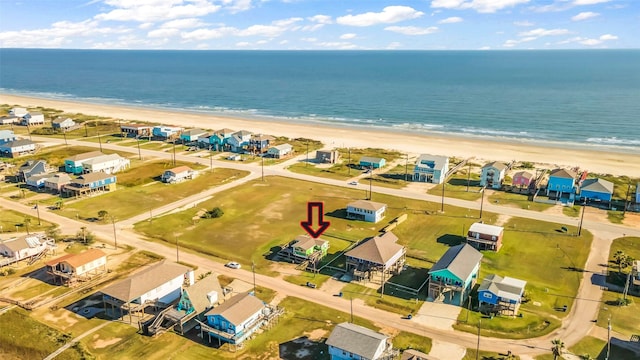 aerial view featuring a view of the beach and a water view