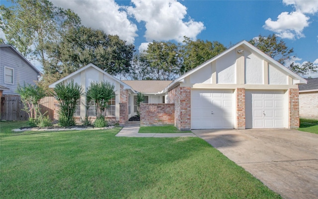 view of front of property with a garage and a front lawn