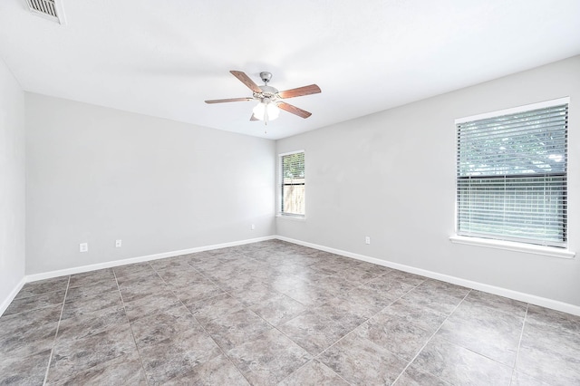 unfurnished room with ceiling fan