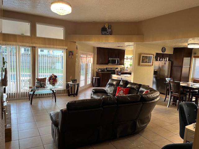 tiled living room with a textured ceiling