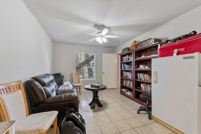 interior space featuring ceiling fan and light tile patterned floors