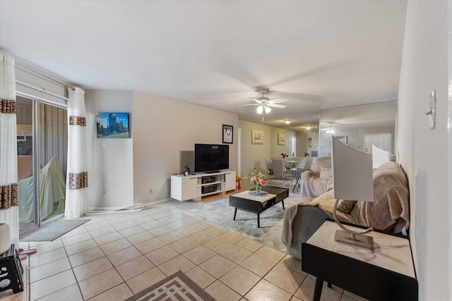 living room featuring ceiling fan and light tile patterned flooring