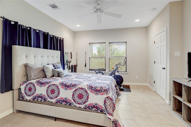 bedroom with ceiling fan and light tile patterned flooring