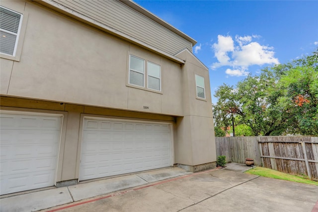 view of side of property featuring a garage