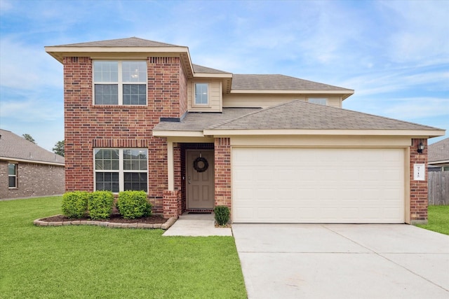 view of front of home with a garage and a front yard