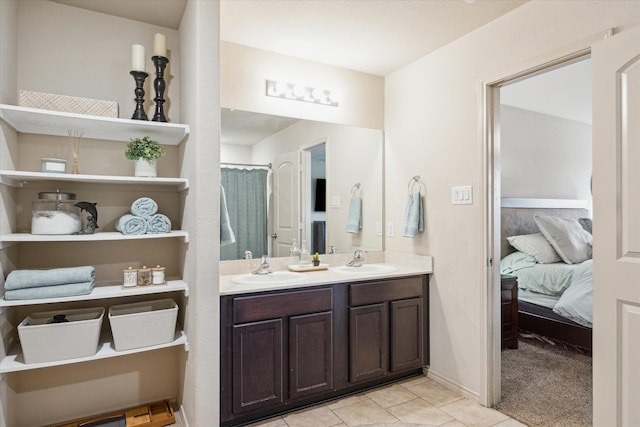 bathroom featuring tile patterned flooring and vanity