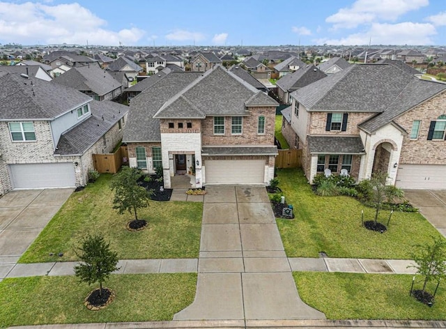 view of front of home with a front lawn and a garage