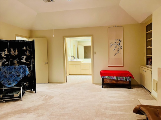 living area featuring light colored carpet and sink