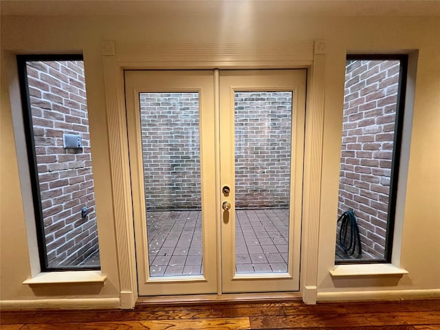 entryway with hardwood / wood-style flooring