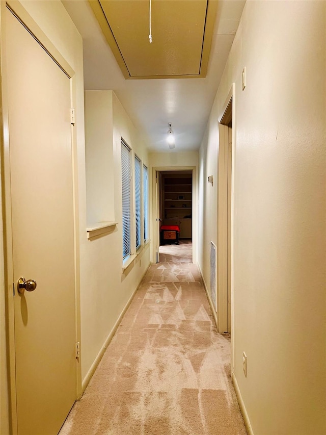 hallway with light carpet