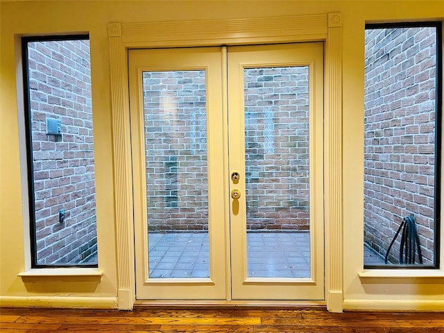 entryway featuring french doors and wood-type flooring