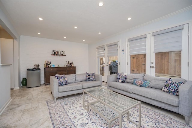 living room featuring crown molding and french doors