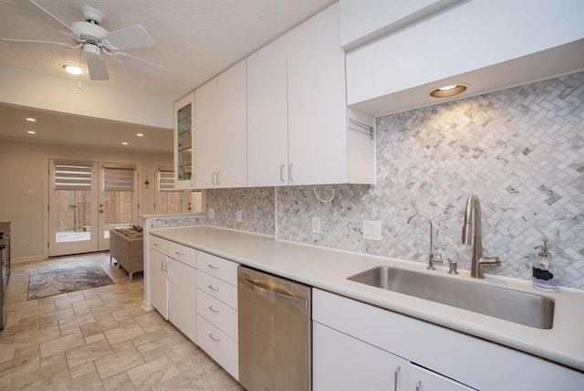 kitchen featuring white cabinetry, dishwasher, ceiling fan, sink, and tasteful backsplash