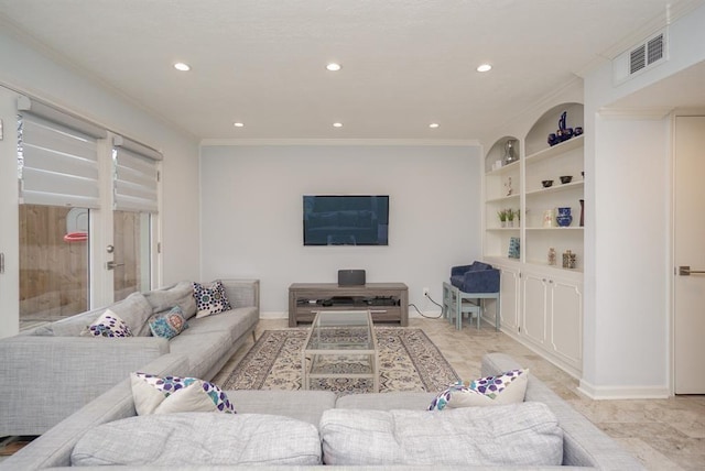 living room with built in features and ornamental molding