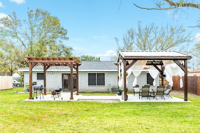 back of house featuring a pergola, a patio, cooling unit, and a lawn