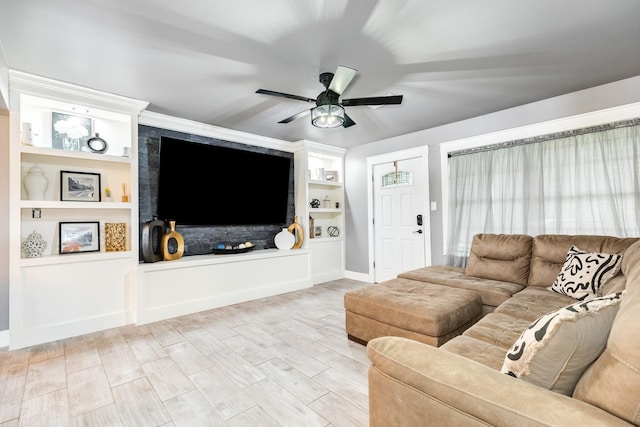 living room with wood-type flooring, built in features, and ceiling fan