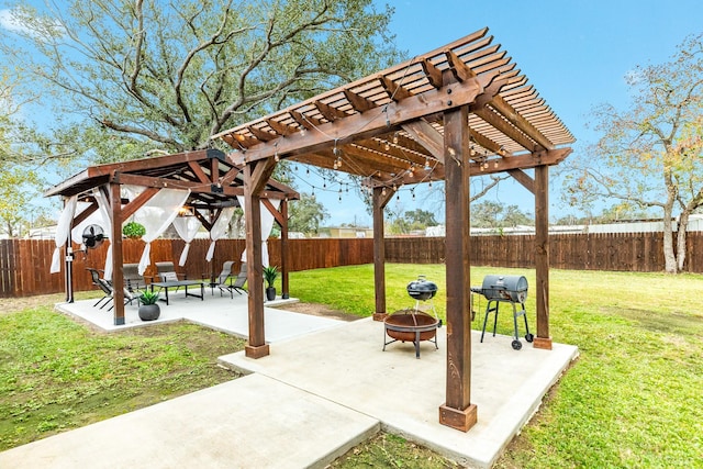 view of home's community with a lawn, a patio area, a pergola, and an outdoor fire pit