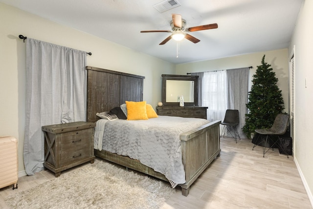 bedroom featuring light wood-type flooring and ceiling fan