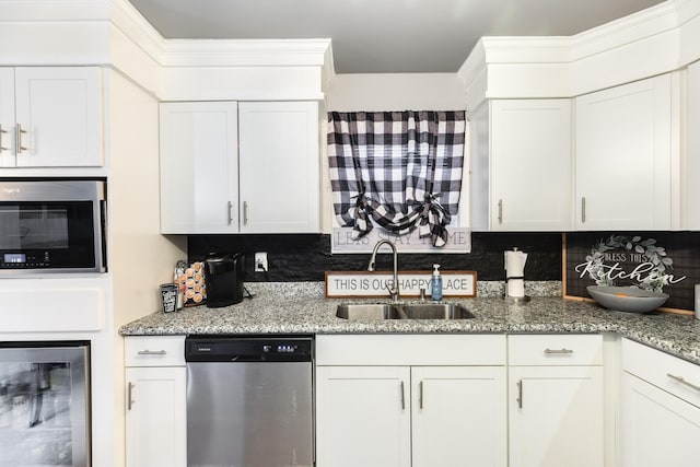 kitchen with dishwasher, white cabinets, beverage cooler, and sink