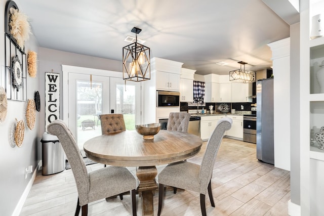 dining area featuring a notable chandelier