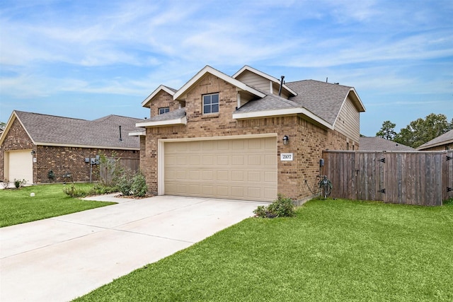 view of front of home featuring a front yard and a garage