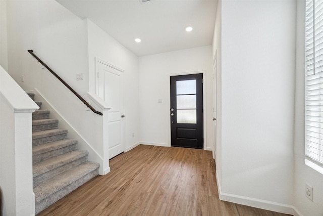 entryway with light hardwood / wood-style flooring