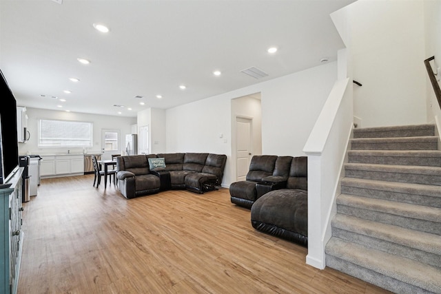 living room with light hardwood / wood-style flooring