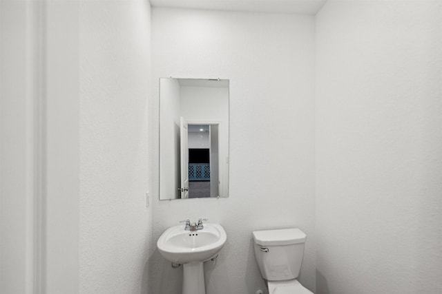 bathroom with toilet and sink