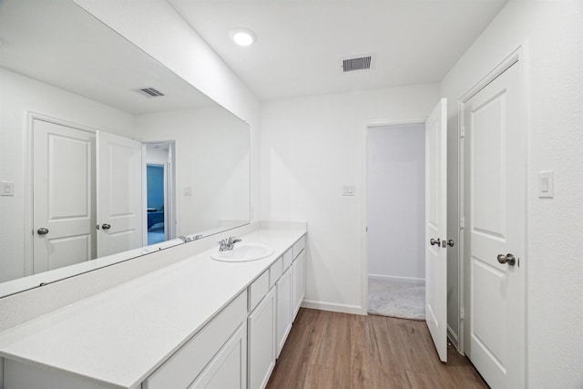 bathroom featuring hardwood / wood-style floors and vanity