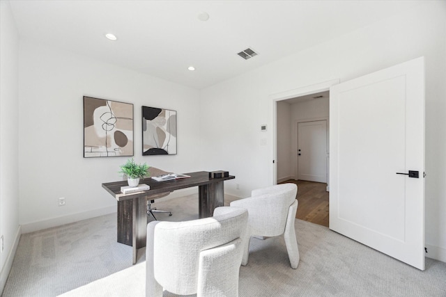 home office featuring light colored carpet, visible vents, baseboards, and recessed lighting