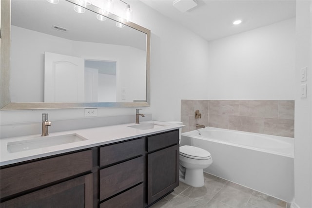 full bathroom featuring a garden tub, a sink, visible vents, and double vanity