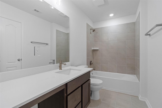 full bathroom featuring tile patterned floors, toilet, bathtub / shower combination, visible vents, and vanity