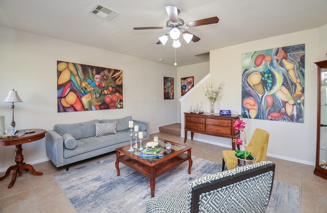 living room featuring ceiling fan and tile patterned flooring