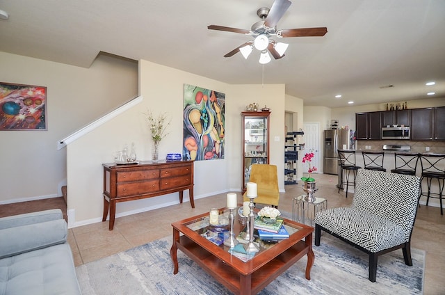 tiled living room with ceiling fan