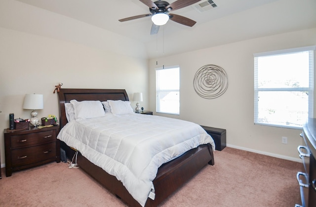 bedroom with ceiling fan and light carpet