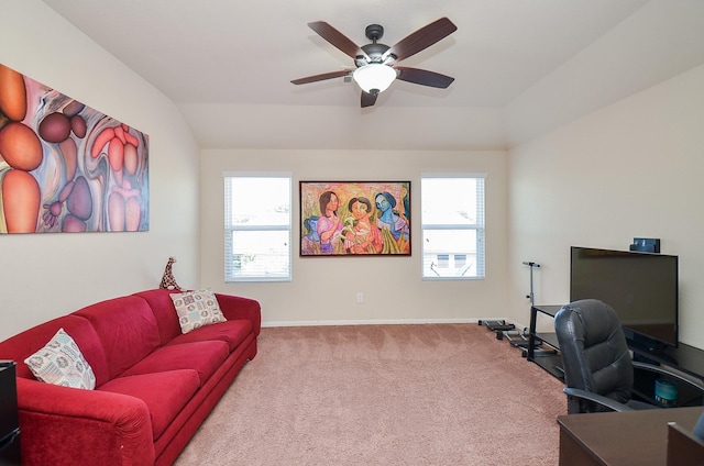 home office featuring light colored carpet, vaulted ceiling, plenty of natural light, and ceiling fan