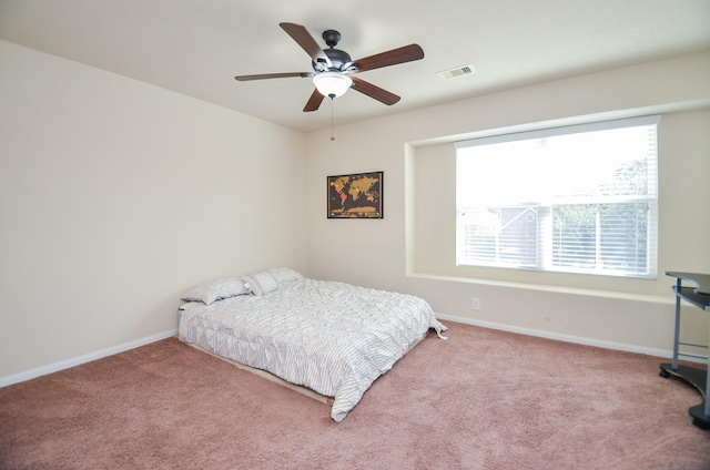 bedroom featuring ceiling fan and light carpet