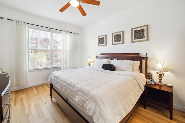 bedroom featuring light hardwood / wood-style flooring and ceiling fan