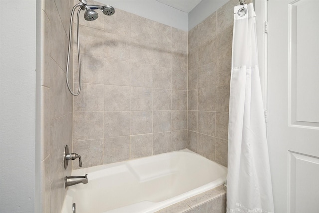 bathroom with shower / bath combo with shower curtain