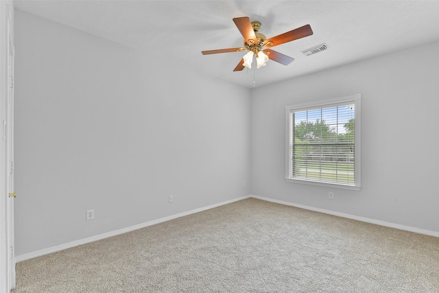 empty room with carpet floors and ceiling fan