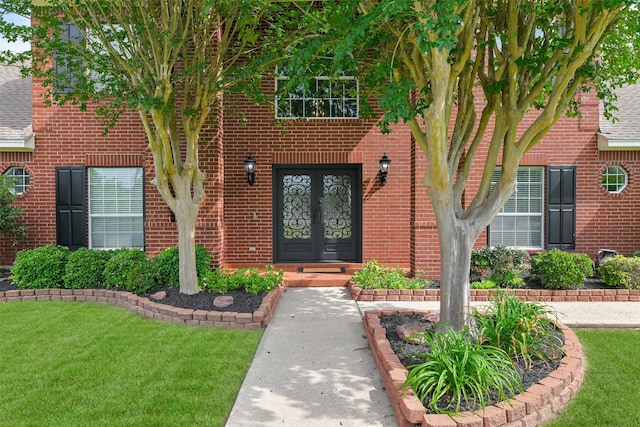 doorway to property with a yard