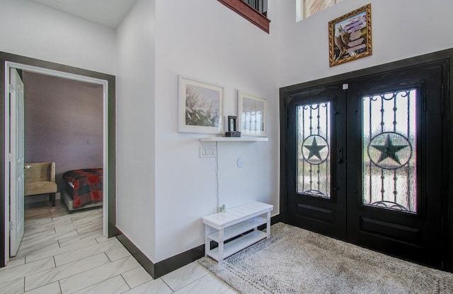 foyer entrance featuring french doors