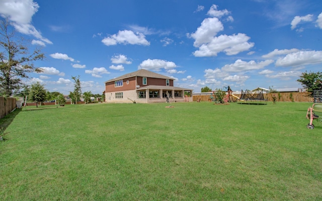 view of yard featuring a trampoline