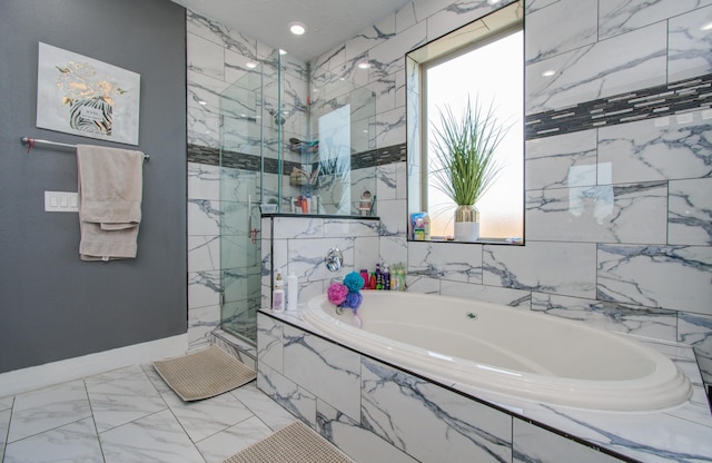 bathroom featuring separate shower and tub