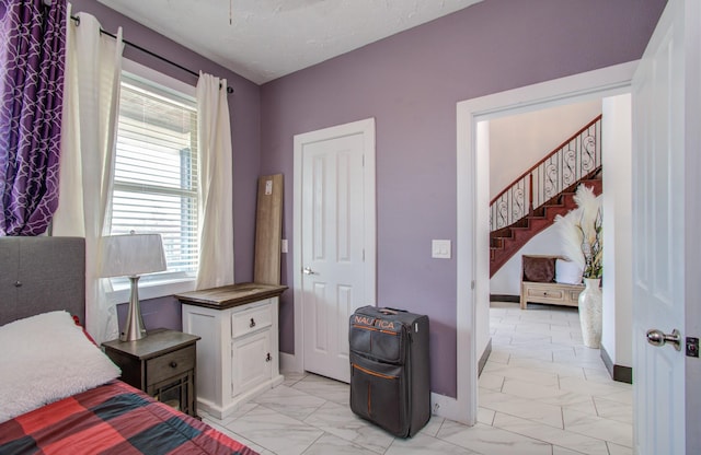 bedroom with multiple windows