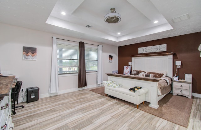 bedroom with a raised ceiling