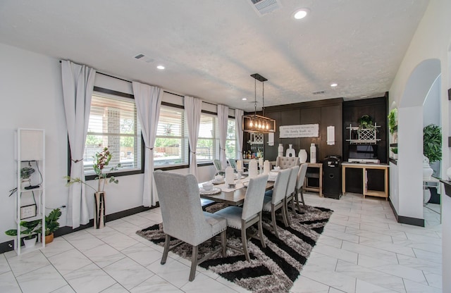 dining area featuring a chandelier